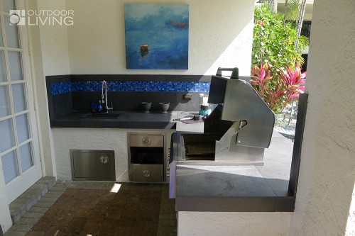 Outdoor kitchen with a BBQ grill and beautiful contertop