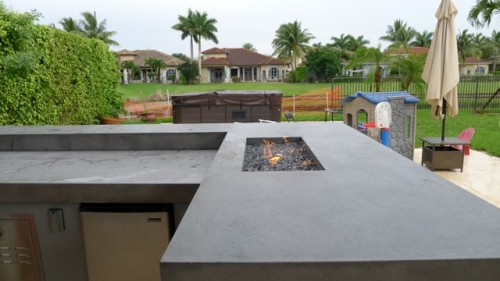 Firepits built into Concrete Counter tops in Outdoor Kitchens