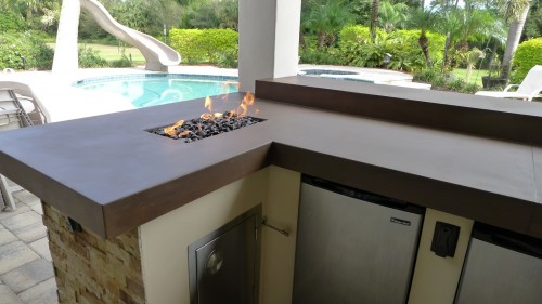 Outdoor Kitchen in Stuart, Florida featuring a firepit countertop