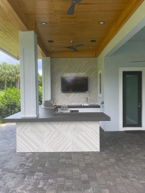 Outdoor kitchen with artistic concrete countertops
