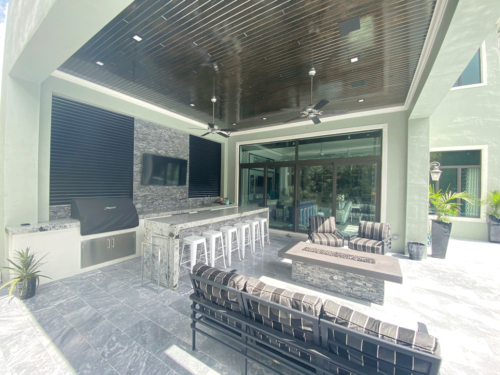outdoor living area with louvered metal in openings